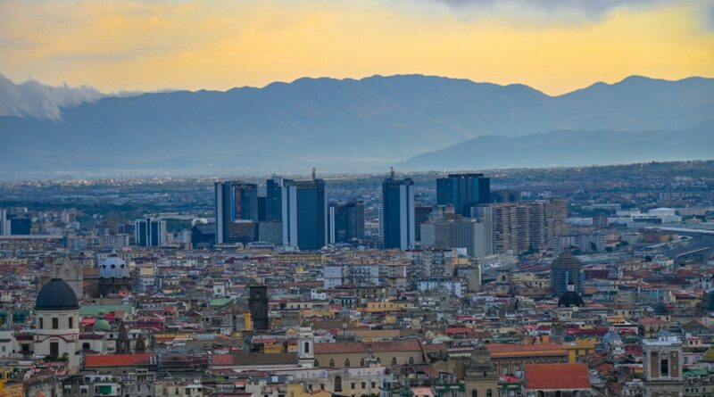 a view of a city with mountains in the background