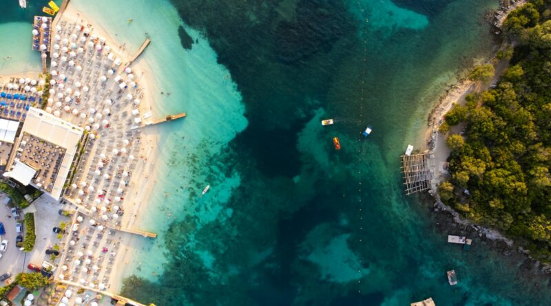 a river with a bridge and buildings